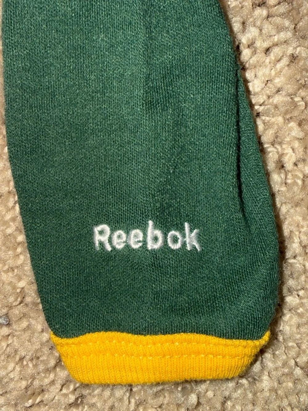 Green Bay Packers baby onesie with green/yellow accents